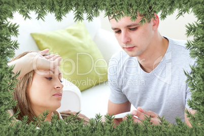Caring man check the temperature of his sick girlfriend with a t