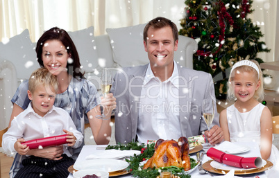 Parents toasting with champagne in christmas dinner