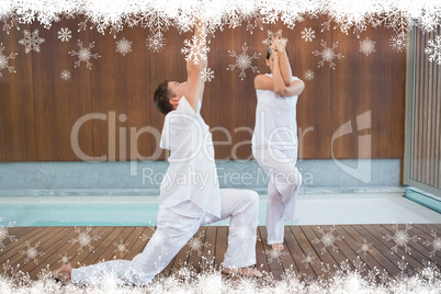 Peaceful couple in white doing yoga together