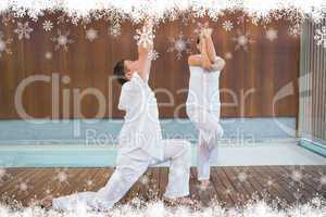 Peaceful couple in white doing yoga together