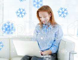 Composite image of cute business woman working on a laptop compu