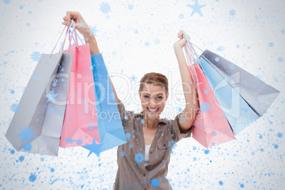 Woman raising her shopping bags