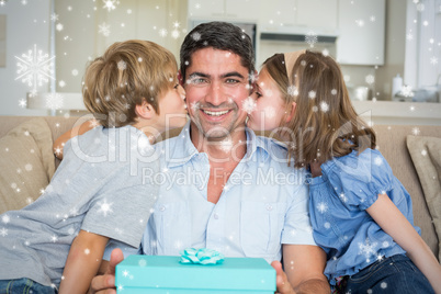 Composite image of children kissing on fathers cheeks