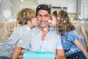 Composite image of children kissing on fathers cheeks