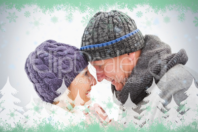 Happy mature couple in winter clothes embracing