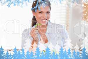 Composite image of smiling woman eating a salad