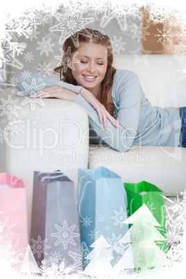 Young woman taking a moment off on her couch after a shopping to