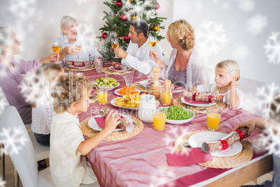 Composite image of adults raising their glasses at christmas din