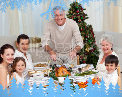 Composite image of grandfather cutting turkey for christmas dinn