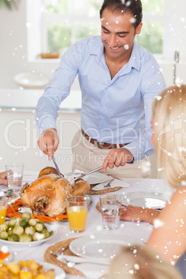 Man standing to carve the turkey