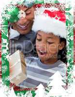 Portrait of an father and son opening a christmas gift