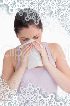 Composite image of woman blowing her nose
