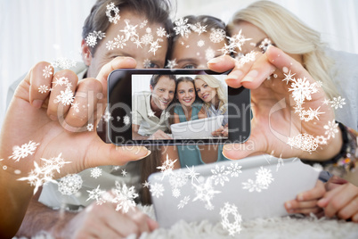 Hand holding smartphone showing photo