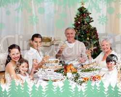 Family toasting with white wine in a christmas dinner