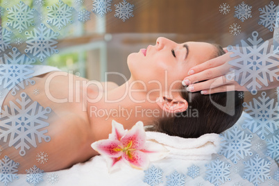 Attractive woman receiving head massage at spa center