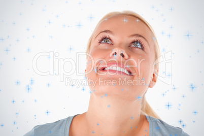 Smiling blond woman looking at the ceiling