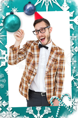 Composite image of geeky hipster in party hat pointing