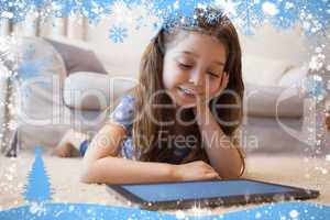 Close up of a little girl using digital tablet in living room
