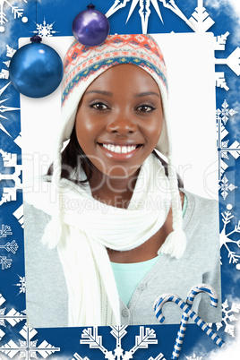 Composite image of smiling young woman in winter clothes