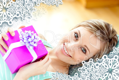 Smiling woman holding a present Smiling woman holding a present