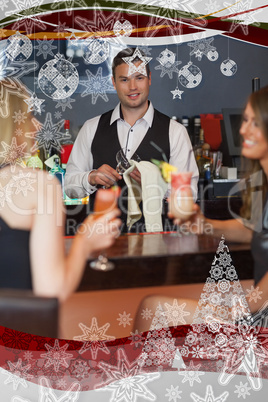 Handsome bartender working while gorgeous friends talking