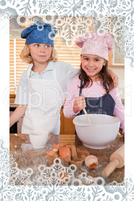 Portrait of siblings baking together