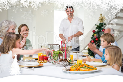 Composite image of family enjoying christmas meal at dining tabl
