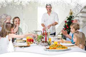 Composite image of family enjoying christmas meal at dining tabl
