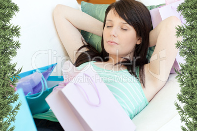 Tired young woman relaxing after shopping