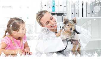 Composite image of veterinarian examining puppy with girl