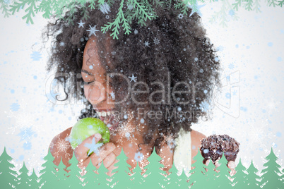 Young woman going to eat a delicious green apple