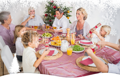 Composite image of family having christmas dinner