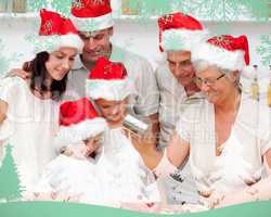 Composite image of happy family baking christmas cakes