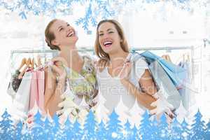 Cheerful women with shopping bags in the clothes store