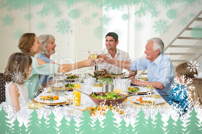 Composite image of family toasting while having meal
