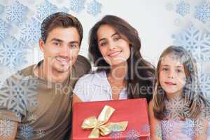 Composite image of father and his daughter offering a gift to he