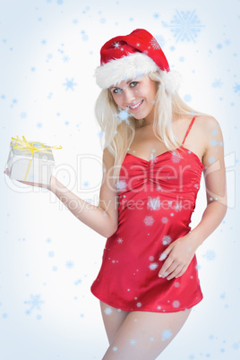 Happy woman holding christmas gift