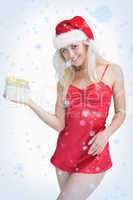 Happy woman holding christmas gift