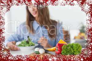 Composite image of pretty woman eating a vegetarian salad