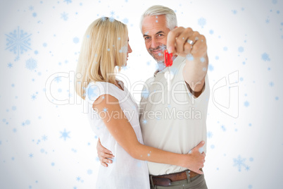 Happy couple showing their new house key