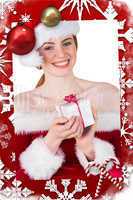 Composite image of pretty girl in santa costume holding gift box