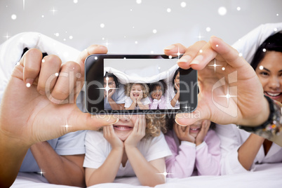 Hand holding smartphone showing photo