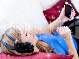 Composite image of woman is listening the music with headphones