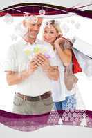 Composite image of happy couple holding shopping bags and cash