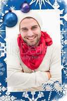 Composite image of attractive young man in warm clothes
