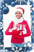 Composite image of beautiful festive woman holding gifts