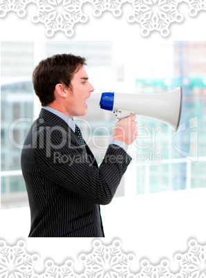 Frustrated businessman yelling through a megaphone