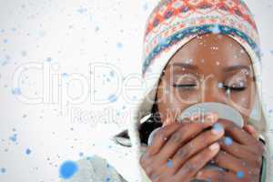 Young woman enjoying a cup of tea in the cold