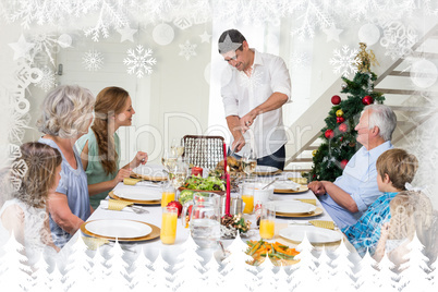 Composite image of father serving christmas meal to family
