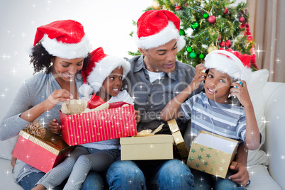 Happy family playing with christmas presents